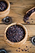 Black rice in a wooden bowl