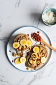Vegan spelt pancakes with bananas, goji berries and coconut