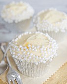Cupcakes with buttercream and white sugar pearls