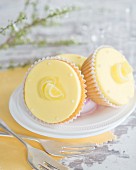 Lemon cupcakes with fondant icing and jelly sweets
