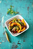 Pumpkin slices with peppers and shallots