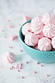 Pink mini meringues in a bowl