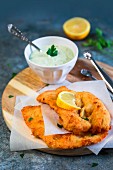 Lemon chicken cutlet with mayonnaise with yoghurt parsley and capers