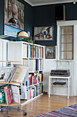 Rotating shelves and bookcase filled with books and records