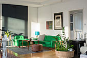 Green sofa set in light-flooded living room