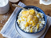 Coconut rice pudding with mango and banana puree
