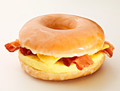 Egg, bacon and cheese in a glazed bagel