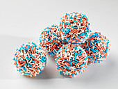 Chocolate pralines with red, white and blue hundreds and thousands