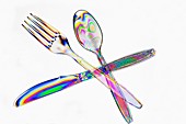 Plastic cutlery under polarised light