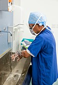 Surgeon washing hands