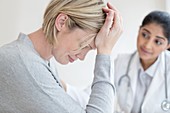 Female doctor listening to patient