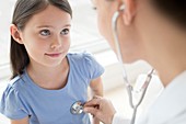 Female doctor using stethoscope