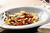 Farfalle with mushrooms, sausage and tomatoes