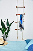 Rope ladder as a coat rack in the bedroom