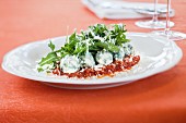 Spinach gnocchi with rocket and tomato sauce
