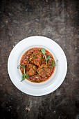 Lamb meatballs in spicy and sour tomato sauce