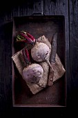Beetroot on a metal tray with a knife