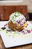 A jacket potato topped with beetroot salad