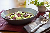 Stewed cucumber soup with sausage