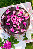 Chocolate cake decorated with rose petals