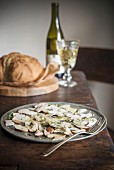 Porcini carpaccio with bread and wine