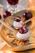 Mousse with cherries and chocolate curls