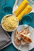 Grilled chicken with couscous and corn on the cob