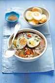 Garlic soup with egg and white cabbage