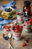 Layered yoghurt desserts with raspberries and redcurrants