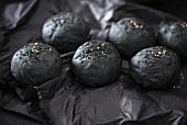 Vegan black burger buns with sesame seeds