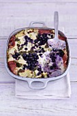 Wild blueberry and feta bake with bacon in an ovenproof dish