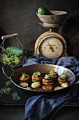 Fried potato slices with bean patties and gherkin relish (vegan)