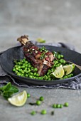Roasted lamb shanks with peas, mint and lime
