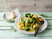 Turmeric and ricotta gnocchi with broccoli and sage