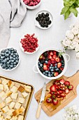 Ingredients for bread pudding with berries (seen from above)