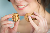 Woman eating walnuts