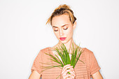 Woman holding chives
