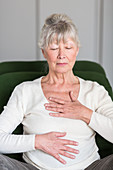 Senior woman practicing respiratory exercises