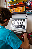 Teenage boy using a computer