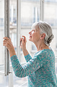 Woman opening window