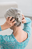 Woman massaging her scalp