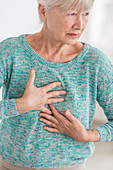 Woman suffering from a mild heart attack