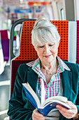 Senior woman on a train