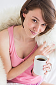 Woman drinking hot beverage