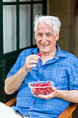 Man eating cherries