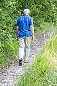 Man walking through meadow