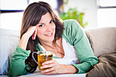 Woman drinking hot beverage