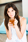 Woman drinking hot beverage