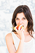 Woman eating a pear