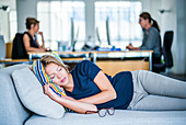 Woman taking a nap in the office